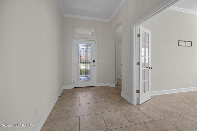 entrance foyer featuring light tile patterned floors and crown molding