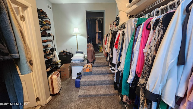 spacious closet featuring carpet flooring and visible vents