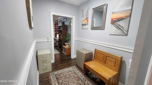 hallway with dark hardwood / wood-style flooring