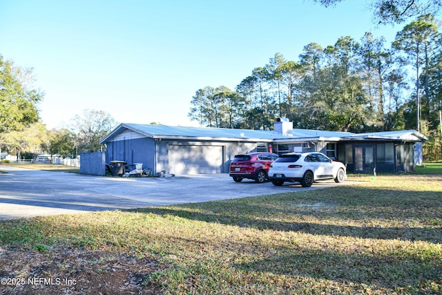 exterior space with a front yard and a garage