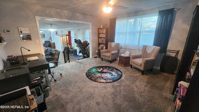 carpeted home office with ceiling fan