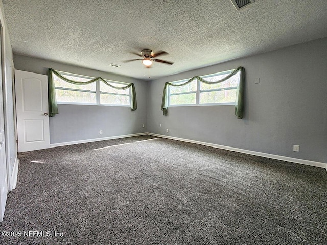 spare room with visible vents, baseboards, carpet, and a ceiling fan