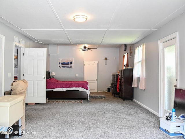 bedroom with carpet flooring and baseboards