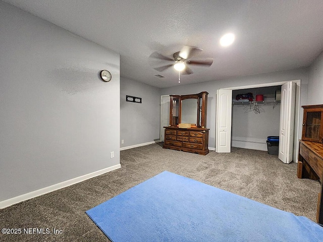 carpeted bedroom with visible vents, baseboards, ceiling fan, a closet, and a textured ceiling