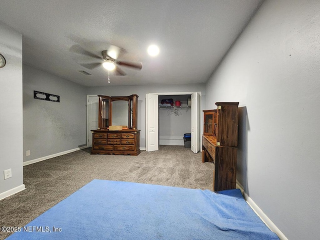 carpeted bedroom featuring visible vents, ceiling fan, baseboards, a closet, and a textured ceiling