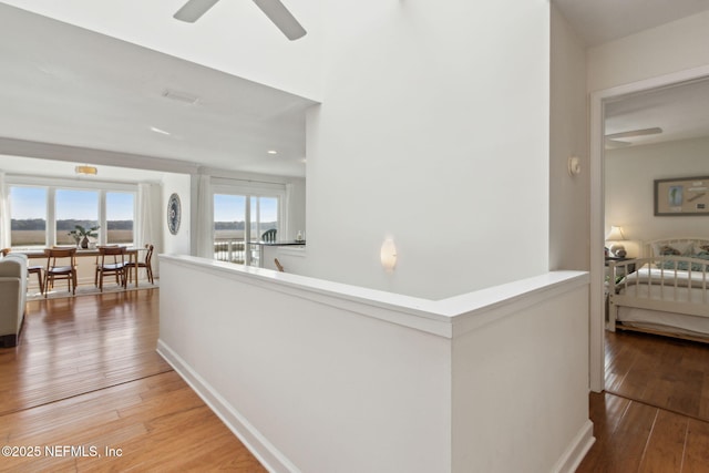 corridor featuring hardwood / wood-style floors