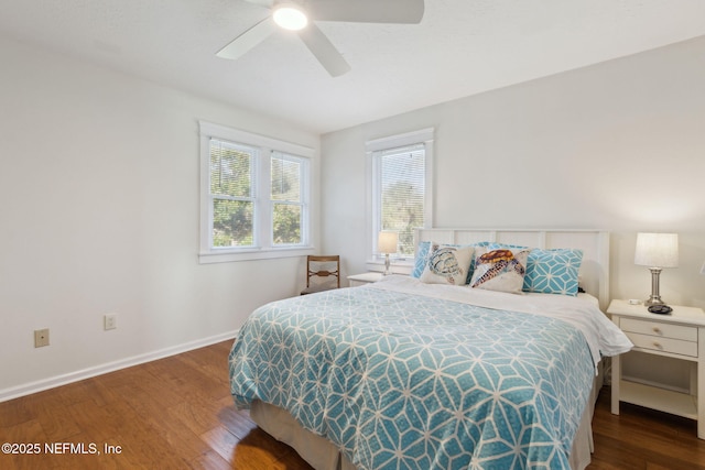 bedroom featuring ceiling fan and dark hardwood / wood-style flooring