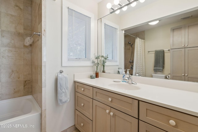 bathroom featuring vanity and shower / tub combo