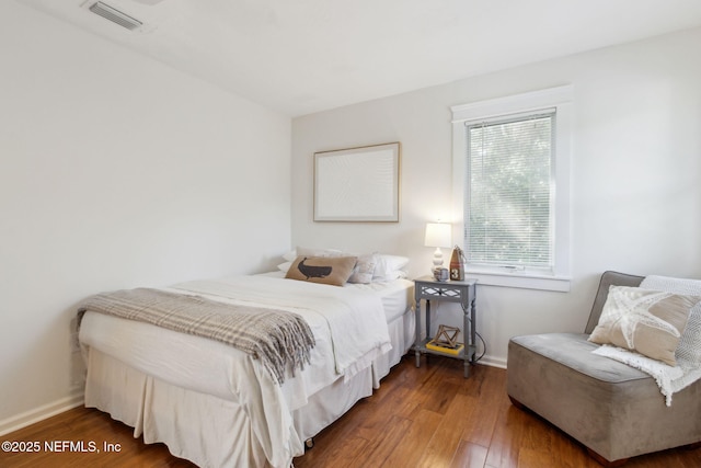 bedroom featuring dark wood-type flooring