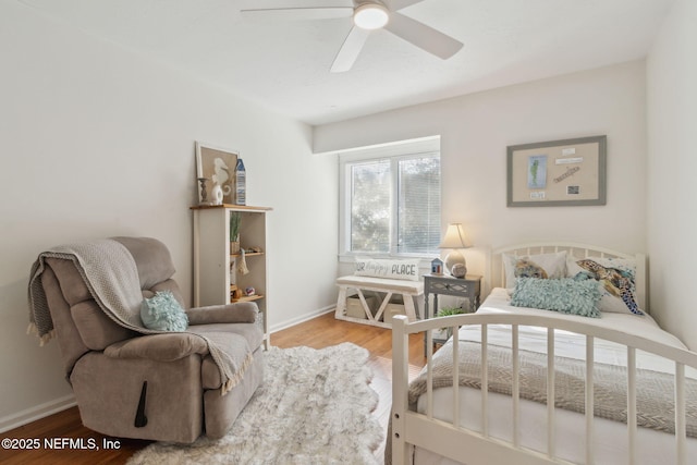 bedroom featuring hardwood / wood-style flooring and ceiling fan