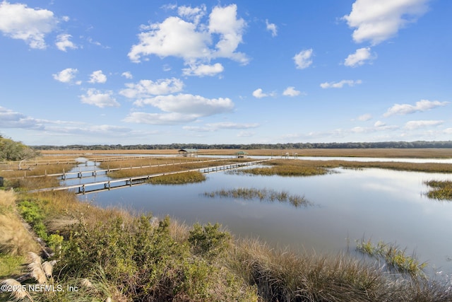 view of water feature with a boat dock and a rural view