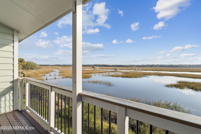 balcony with a rural view and a water view