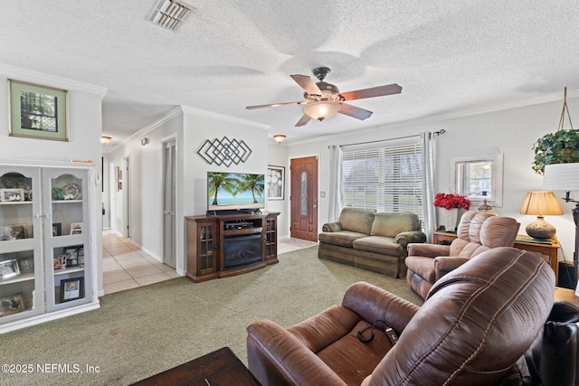 living room with light carpet, a textured ceiling, ceiling fan, and crown molding