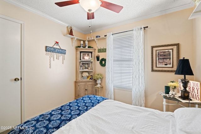 bedroom featuring a textured ceiling, ceiling fan, and crown molding