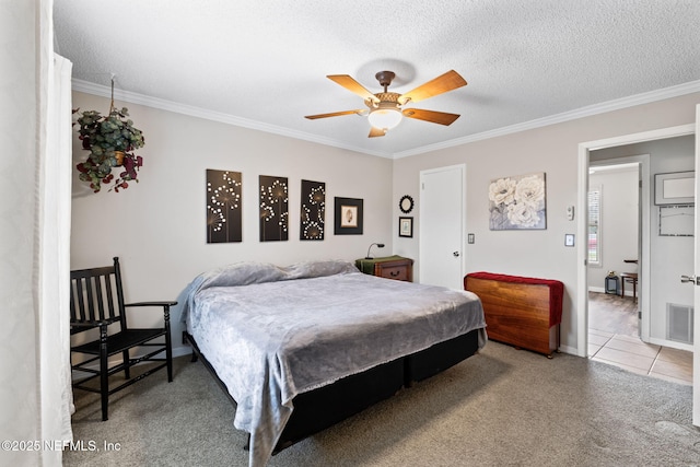 bedroom with ceiling fan, crown molding, and a textured ceiling