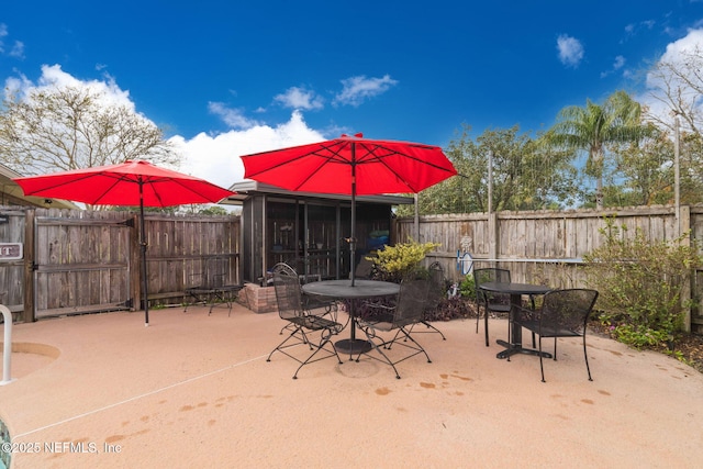 view of patio / terrace with a sunroom