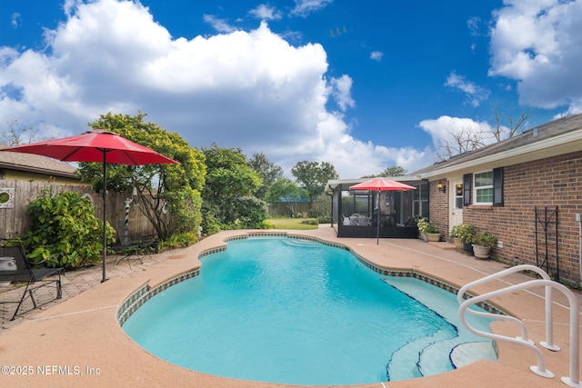 view of swimming pool with a patio area