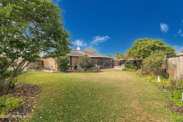 view of yard with a sunroom