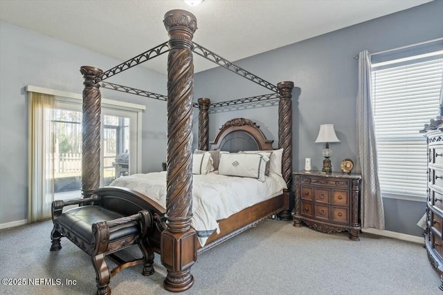 carpeted bedroom with a textured ceiling