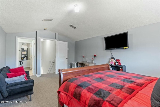 bedroom featuring carpet, a textured ceiling, and vaulted ceiling