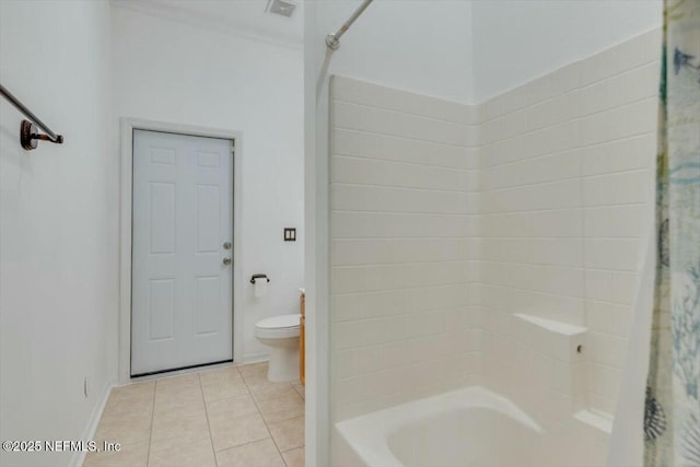 bathroom with tile patterned flooring, shower / bath combination with curtain, and toilet