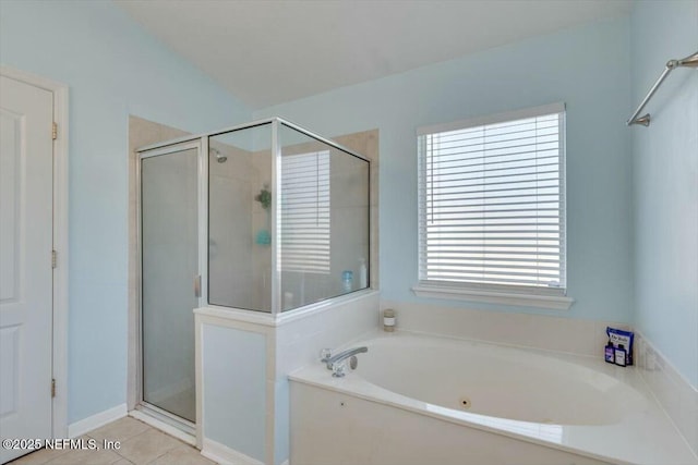 bathroom featuring tile patterned flooring, lofted ceiling, and plus walk in shower