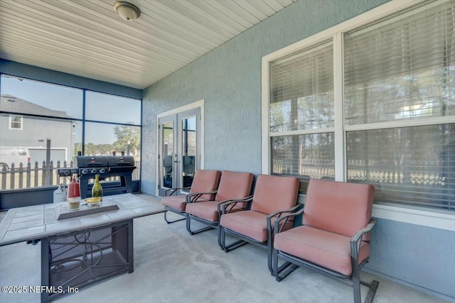 view of patio / terrace featuring a grill and french doors