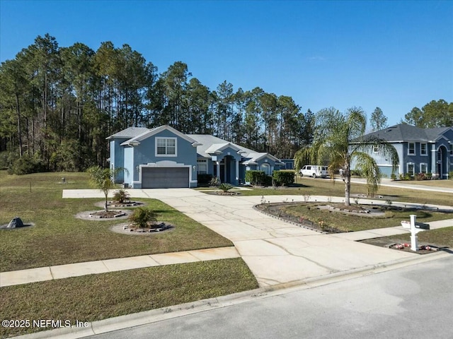 ranch-style house with a garage and a front yard