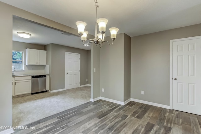 interior space featuring hardwood / wood-style floors and a notable chandelier