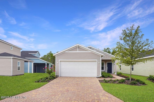 view of front of home with a garage and a front lawn