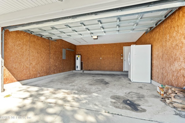 garage with wood walls, electric water heater, a garage door opener, electric panel, and white fridge