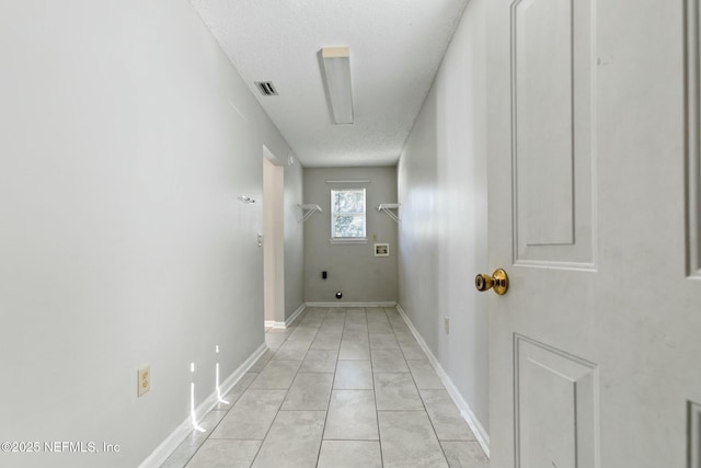 corridor with a textured ceiling