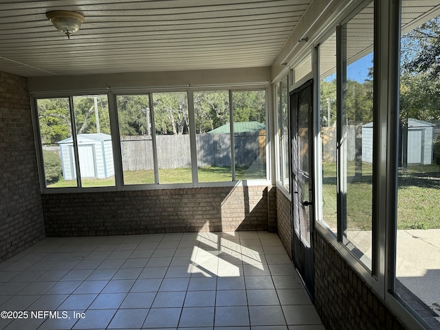 unfurnished sunroom featuring a wealth of natural light