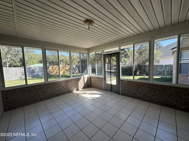 unfurnished sunroom featuring plenty of natural light