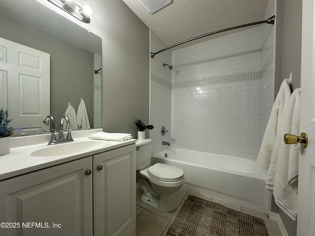 full bathroom featuring tile patterned floors, a textured ceiling, toilet, shower / tub combination, and vanity