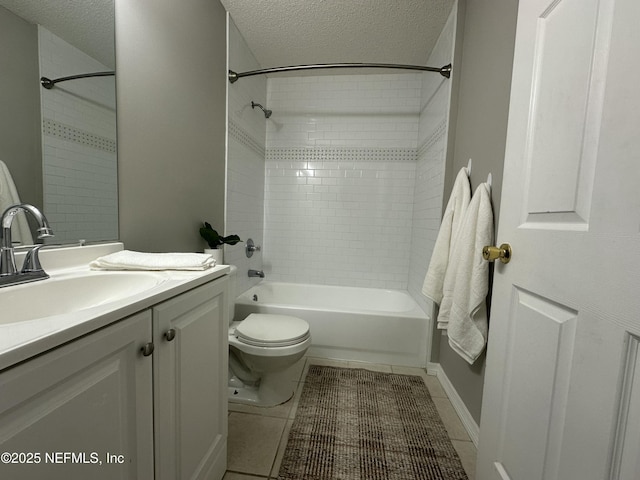 full bathroom with tile patterned flooring, vanity, and a textured ceiling