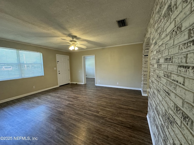 unfurnished room featuring ornamental molding, a textured ceiling, ceiling fan, and dark wood-type flooring