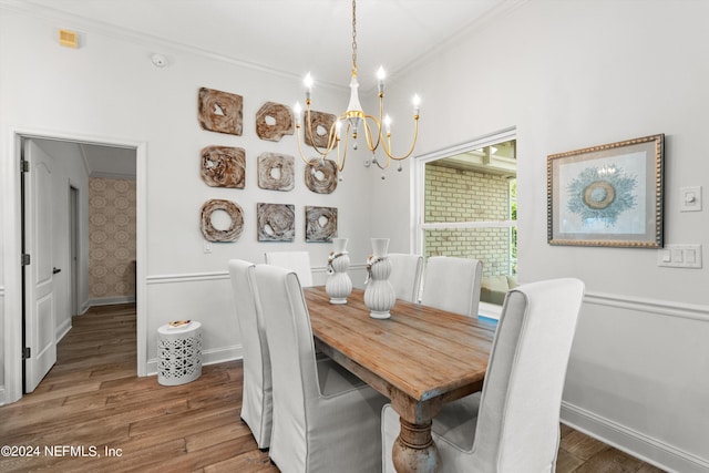 1669 Linkside Ct N, Atlantic Beach, FL 32233 - dining area with wood finished floors, a chandelier, baseboards, and ornamental molding