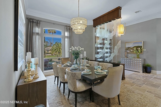 dining room featuring a notable chandelier and crown molding