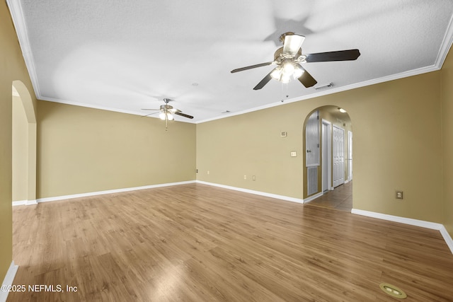 unfurnished room featuring ceiling fan, hardwood / wood-style floors, and crown molding