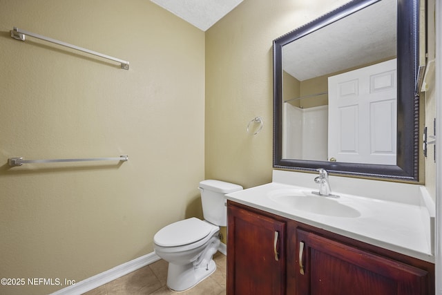 bathroom featuring a textured ceiling, tile patterned flooring, vanity, toilet, and walk in shower