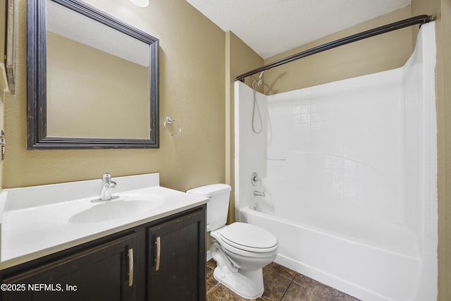 full bathroom with a textured ceiling, toilet,  shower combination, and vanity