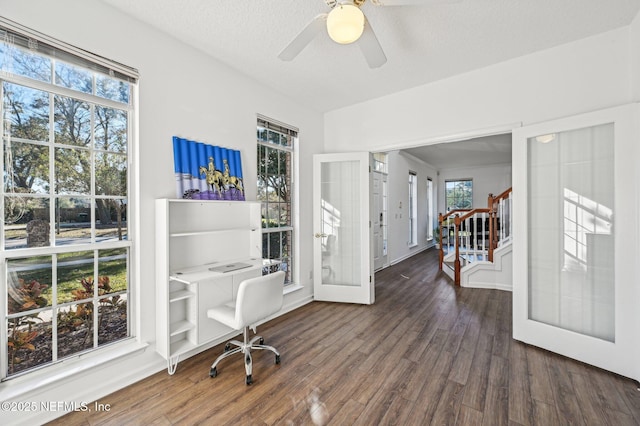 office area with a textured ceiling, ceiling fan, dark wood-type flooring, and french doors