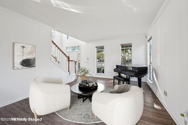 living room with dark hardwood / wood-style flooring and crown molding