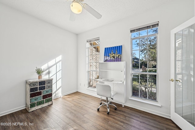 office area featuring ceiling fan, wood-type flooring, and a textured ceiling