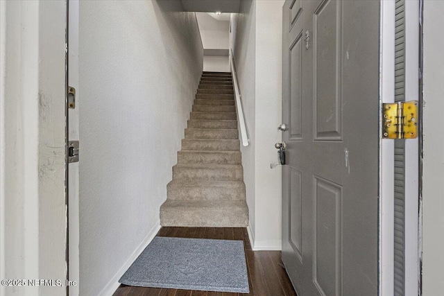 staircase featuring hardwood / wood-style floors