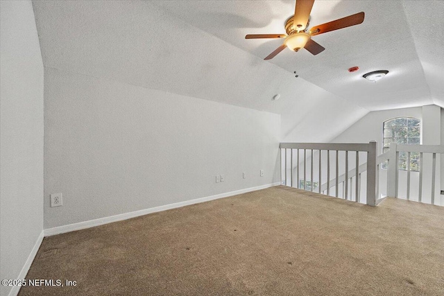 bonus room featuring carpet flooring, ceiling fan, and vaulted ceiling