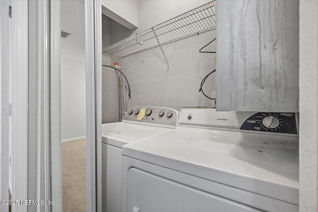 laundry room with independent washer and dryer