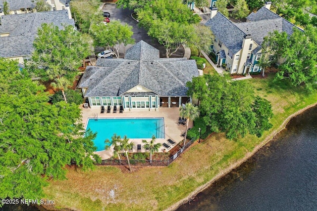 birds eye view of property with a water view