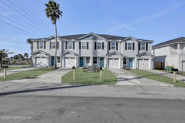 view of front of property with a front yard, central AC, and a garage